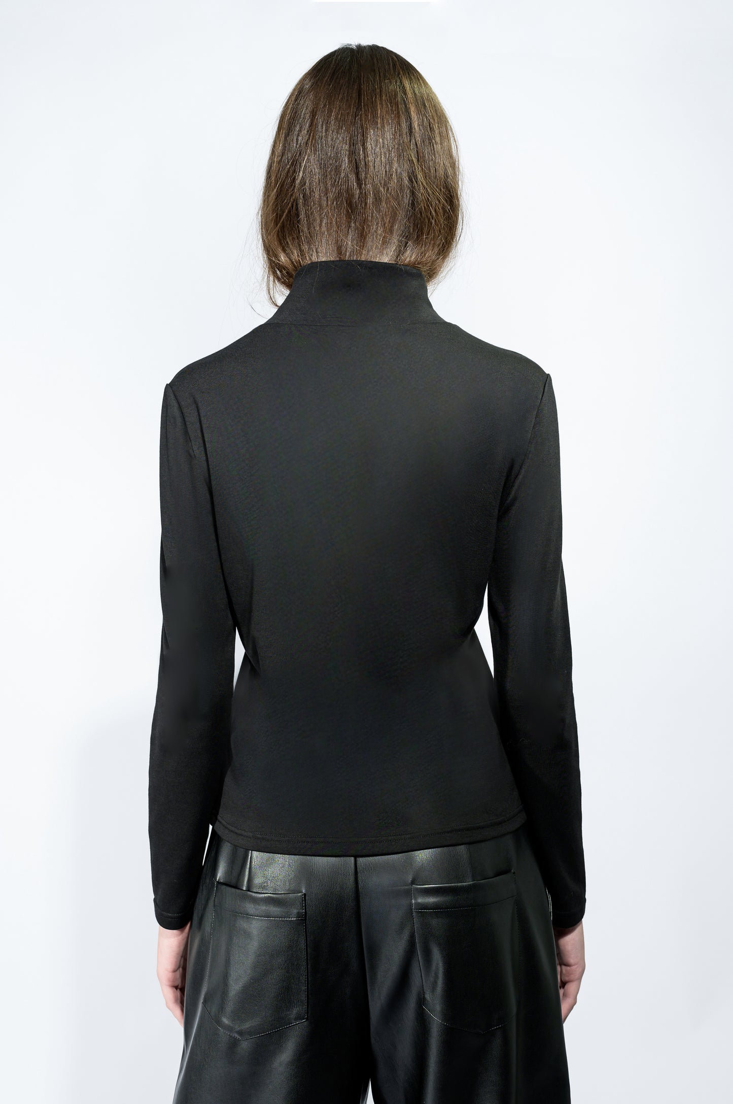 The Cross Turtleneck Top in Black