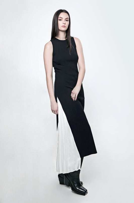 Black ribbed maxi dress with a fitted silhouette and contrast pleated panel