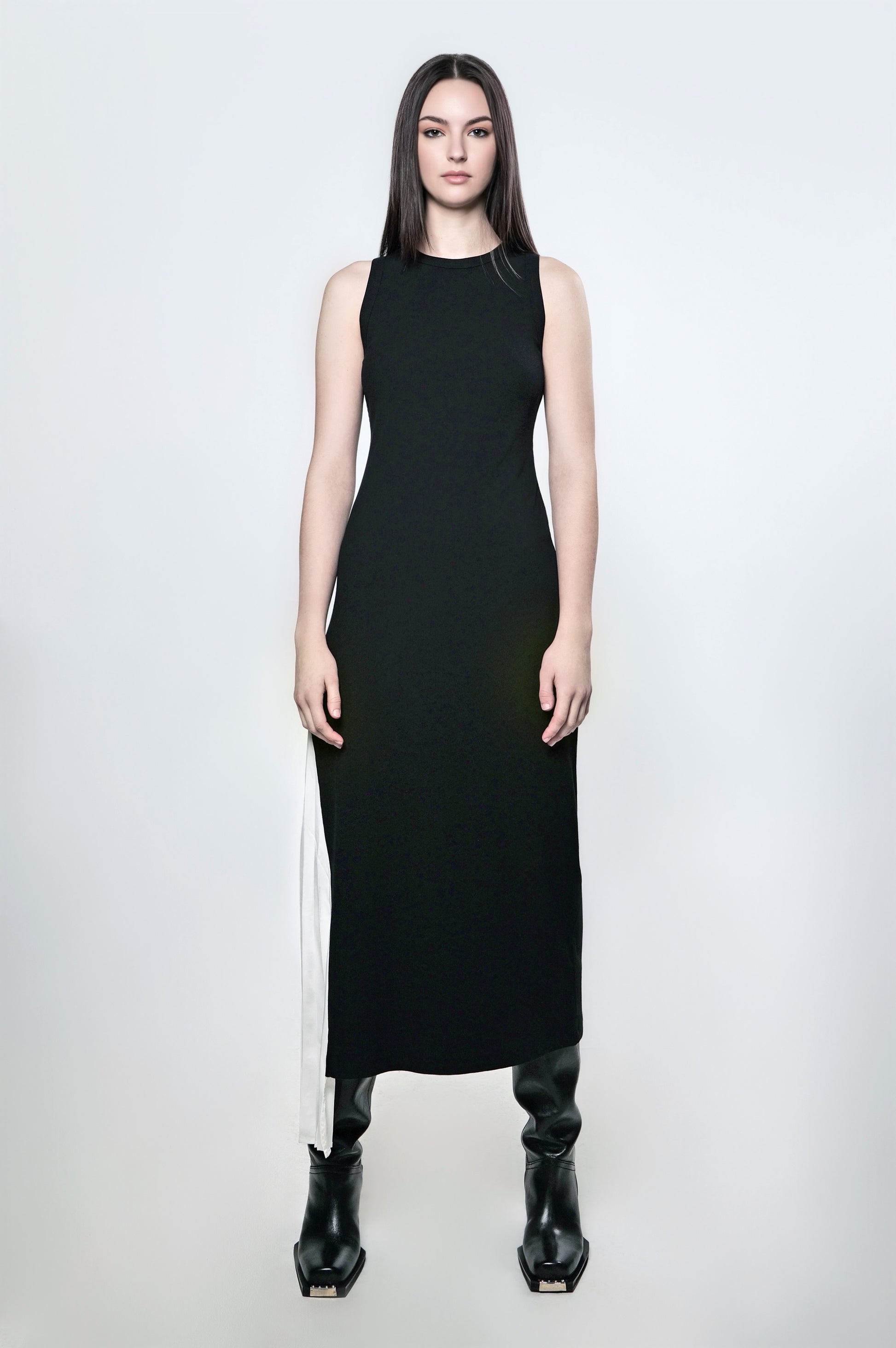 Black ribbed maxi dress with a fitted silhouette and contrast pleated panel.