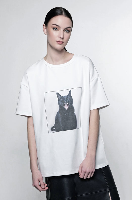 Oversized t-shirt with black cat graphic.