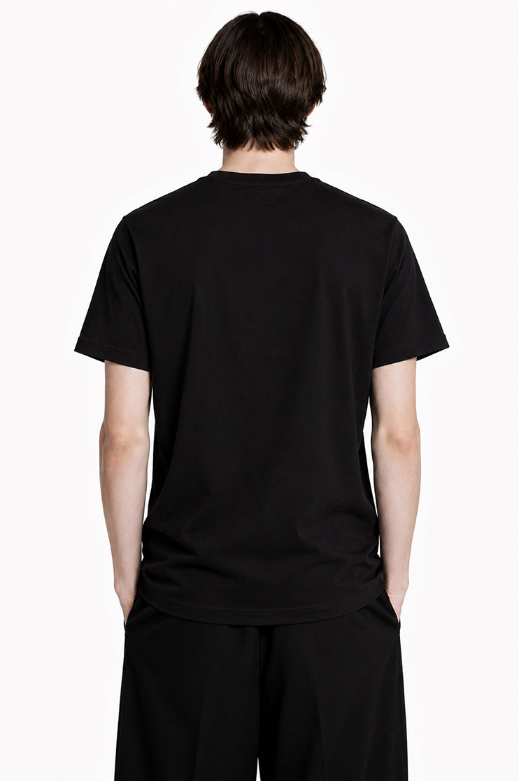 Back view of a man wearing a black t-shirt